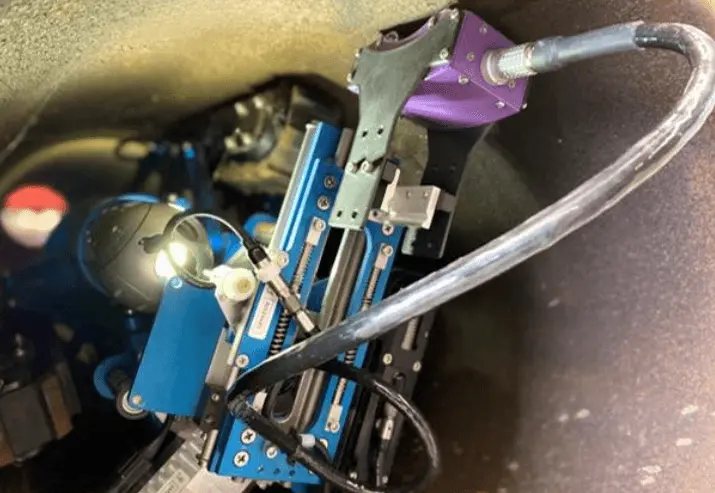 Robotic crawler sewer inspection camera inside a pipe capturing high-definition footage for plumbing inspection.